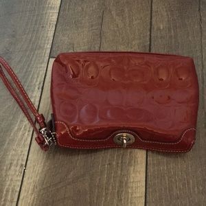 Red patent Coach wristlet
